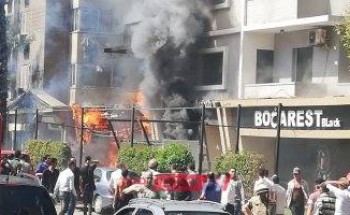 بالصور| الحماية المدنية تحاول السيطرة على حريق فندق بالدُقي