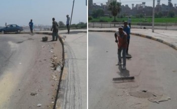 بالصور شن حملة لتجريف الرمال بشوارع ومحاور مدينة دمياط